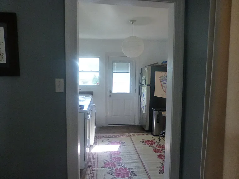 Looking into the kitchen from the dining space.