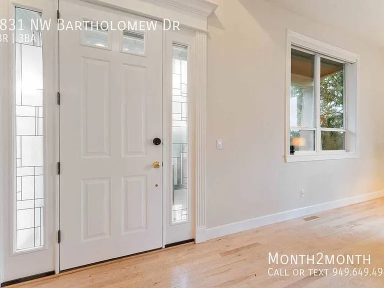 9831 NW Bartholomew Dr — Photo 30