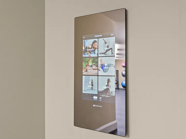 Interactive fitness mirror with on-demand classes