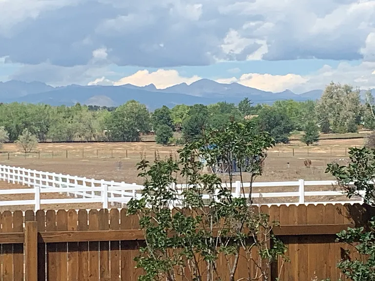 View of open space and mountains from deck