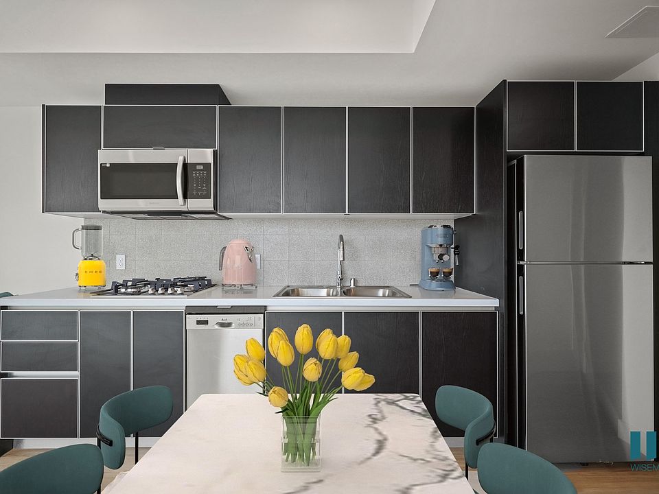 Open-Concept Kitchen with Stainless-Steel Refrigerator, Dishwasher, Stove Range, and Microwave Oven - Pear Floor Plan