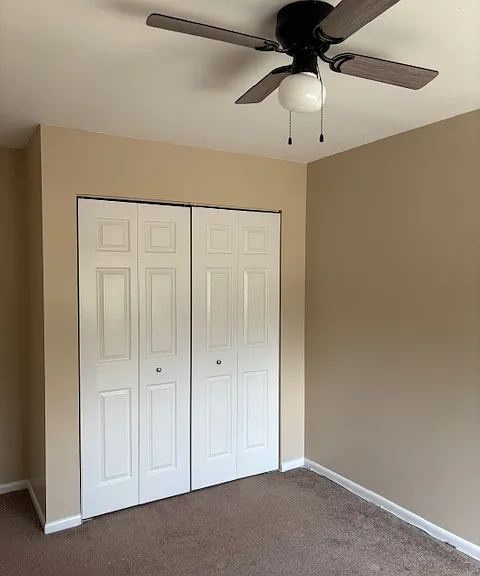 third bedroom with ceiling fan
