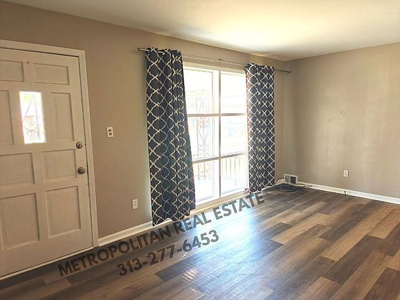 Living Room facing front door from kitchen doorway