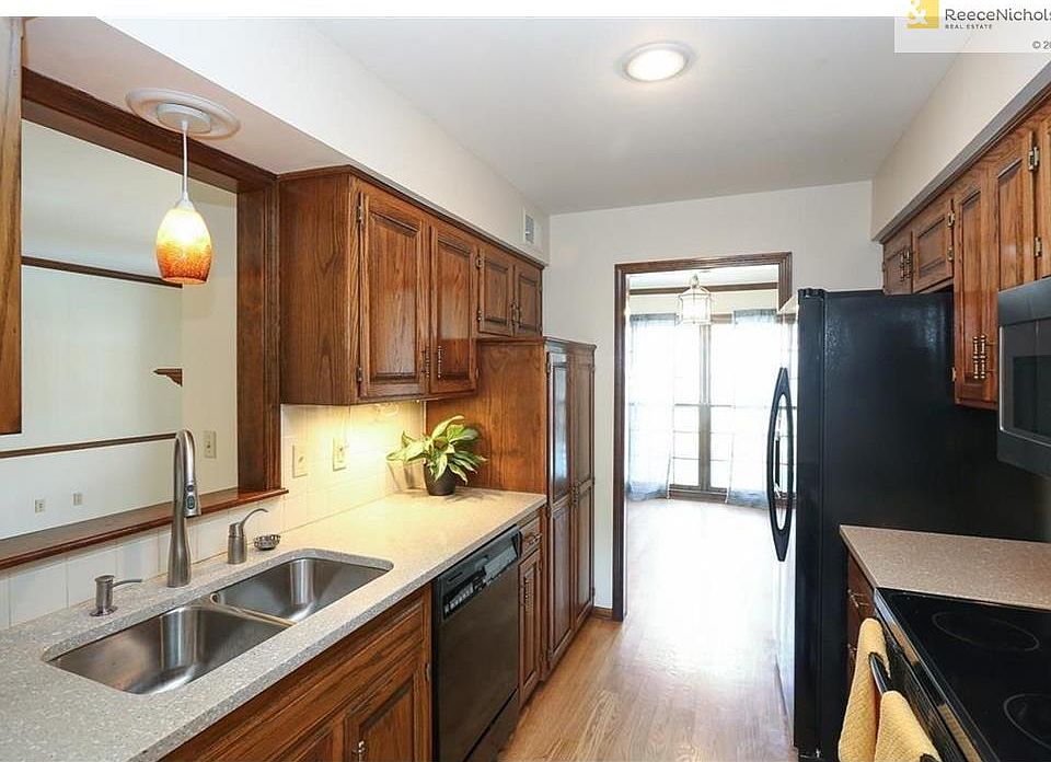 Solid surface counters, newer appliances, large pantry