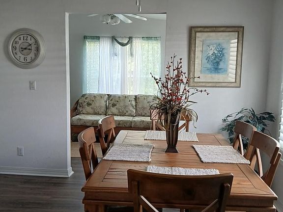 Home has a huge dining room table inside the kitchen area