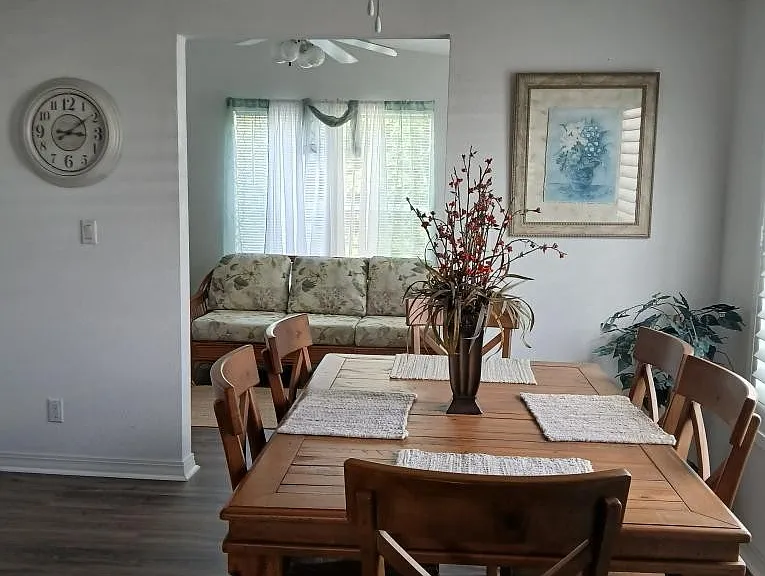 Home has a huge dining room table inside the kitchen area