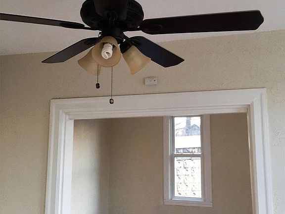 Large living room and dining room with hardwood floors