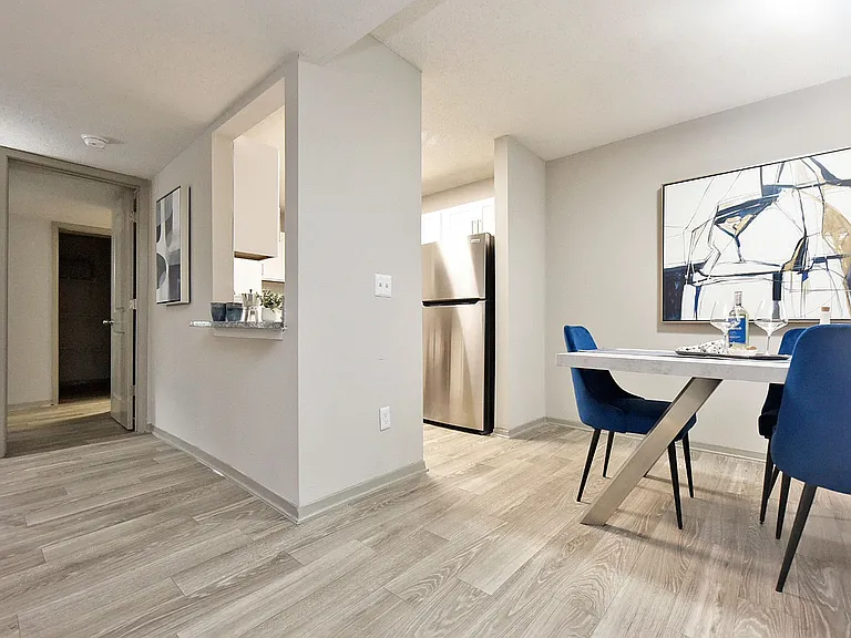 Dining area with hardwood-style flooring & built-in lighting