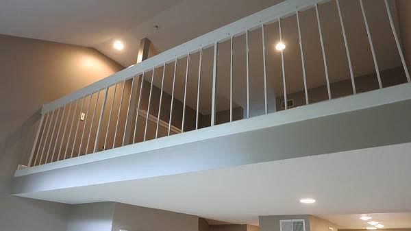 View from living area looking up at the loft (bedroom and full bath) area...