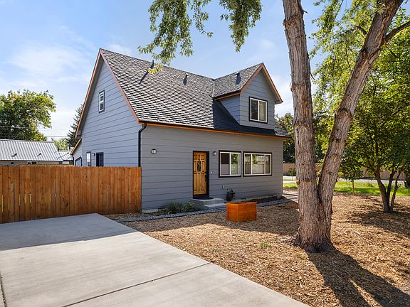Front of house and large driveway for up to 4 cars
