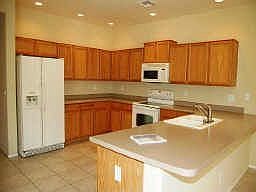Bright and Spacious Kitchen overlooks oversized Family Rm and Backyard!