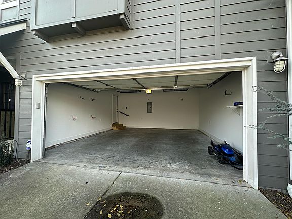 Spacious 2 Car Garage with keypad and storage racks