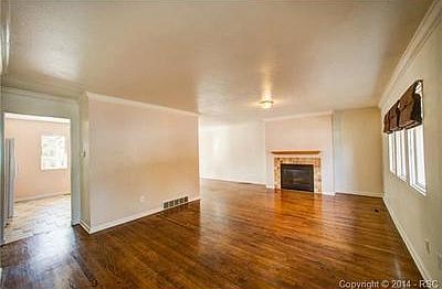 From the living room into the kitchen on the left, and to the di