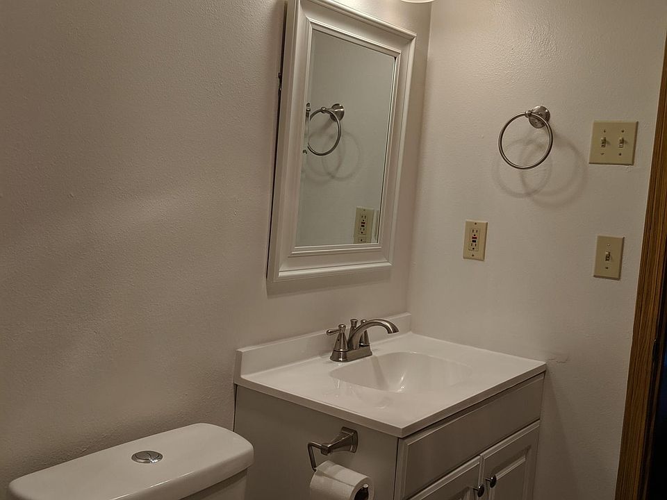 Master bathroom new toilet, vanity, and fixtures.