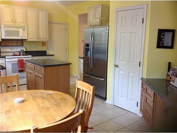 Pantry door, SS Refrigerator, and desk area of Kit