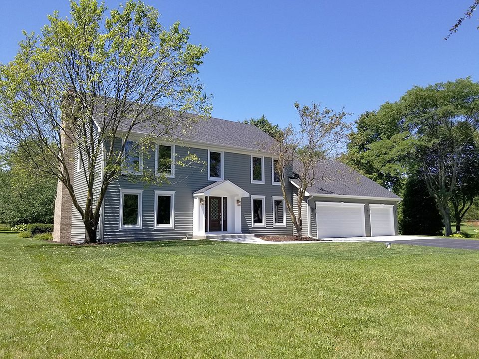 Totally remodeled...new roof, siding, windows, sidewalks, garage doors and openers and more!