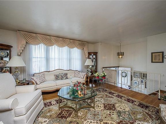 Enjoy gorgeous hardwood floors in the large living room.