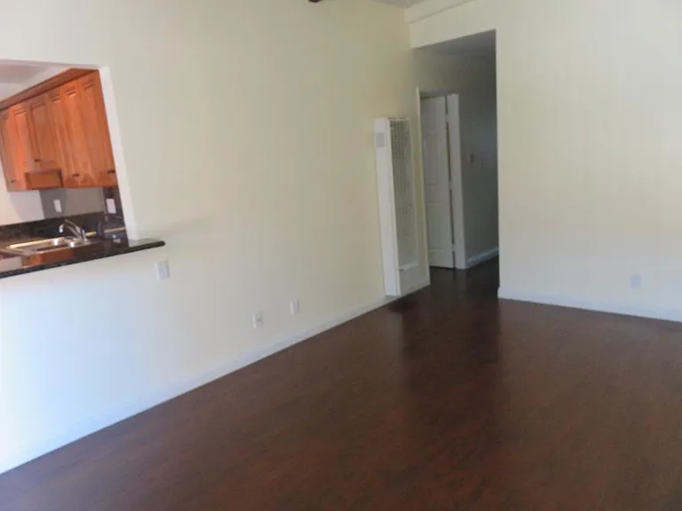 Living area as you enter the front door. Kitchen is left.