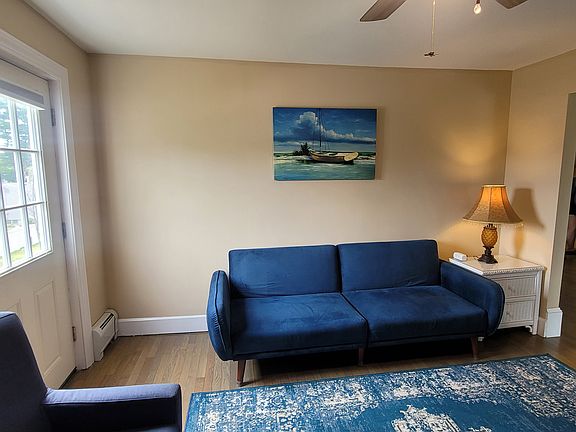 Living room with door to small outdoor balcony