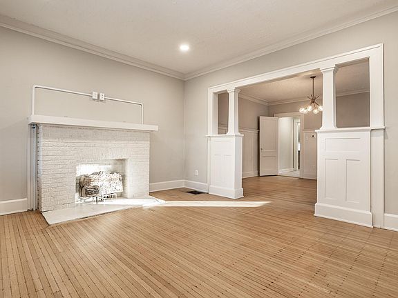 Living room with decorative fireplace.
