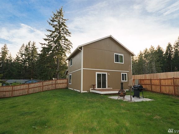 Another View of the Large Fenced-In Side and Backyard with Deck and Patio.