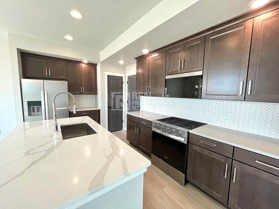 Be the First to Live Here! Stunning New Wolf Ranch Home with Modern Finishes — Photo 4