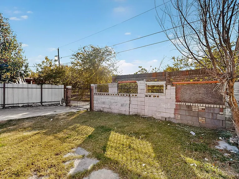 Fenced yard featuring a gate