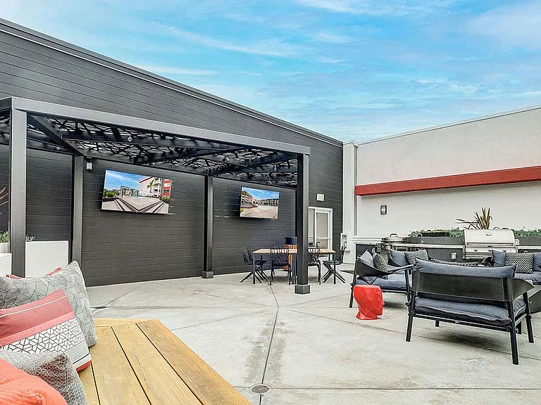 Griffis Platinum Triangle rooftop deck with TVs and BBQ grills.