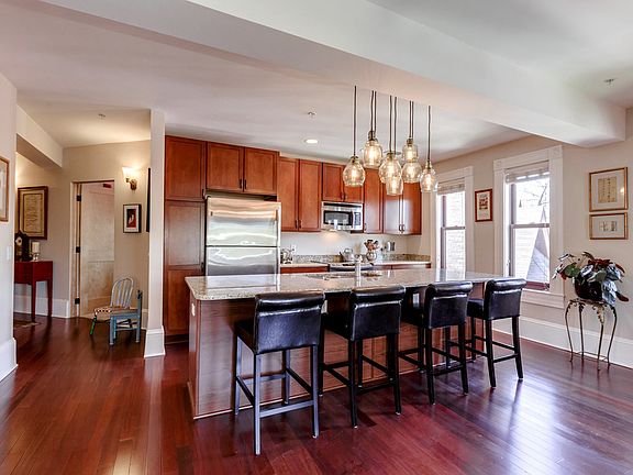 Chef's kitchen with ample storage in cherry cabinetry
