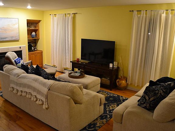 Living room with propane fireplace- turn it on with the flip of a switch