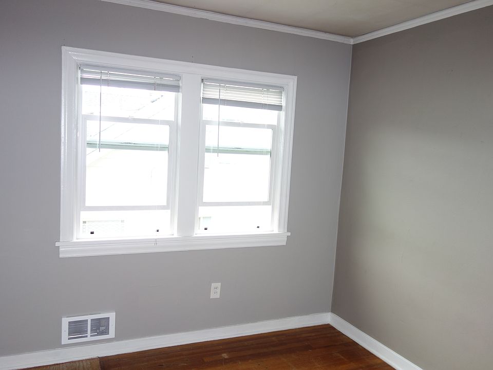 Bedroom 1 with bright window view