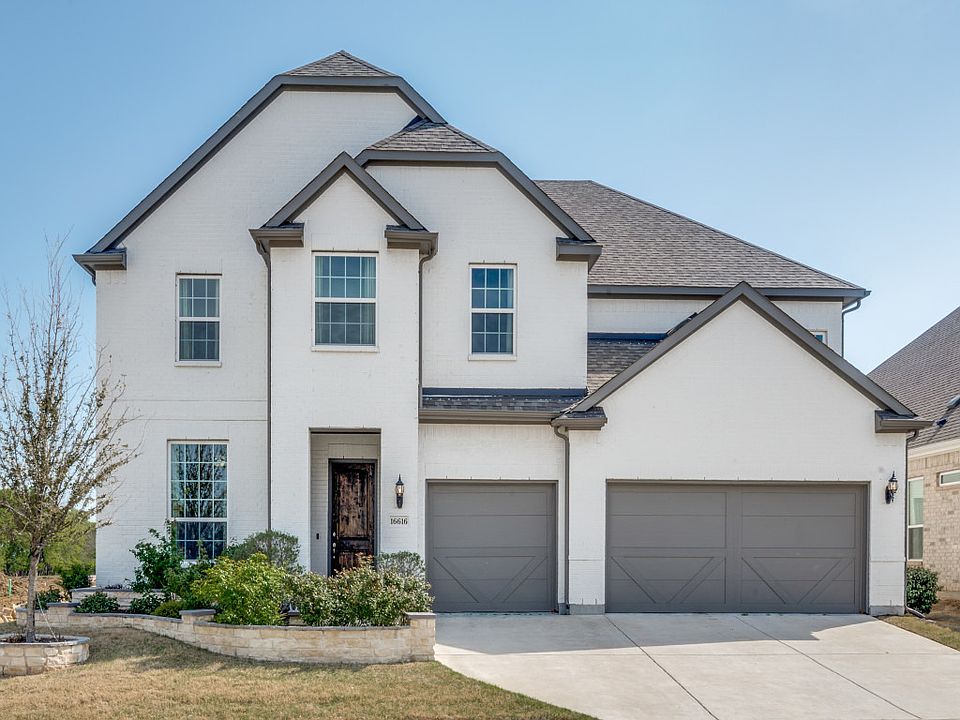 North facing white brick home with spacious 3 car garage and over 4,000 SF of living space on an oversized corner lot