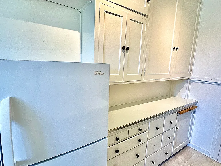 Unit #303-similar kitchen with incredible cabinetry space!
