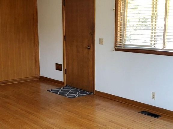 front door to living room, dining area.,