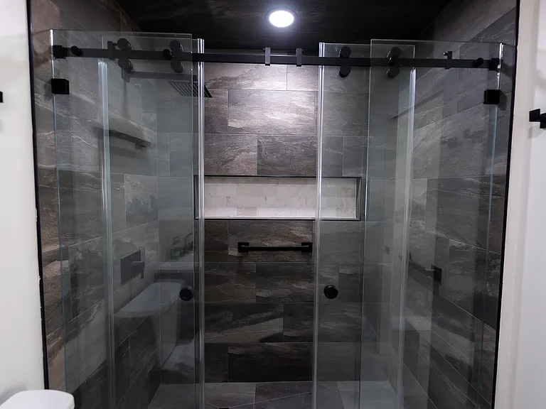 En-suite walk-in shower view. Fully remodeled bathroom