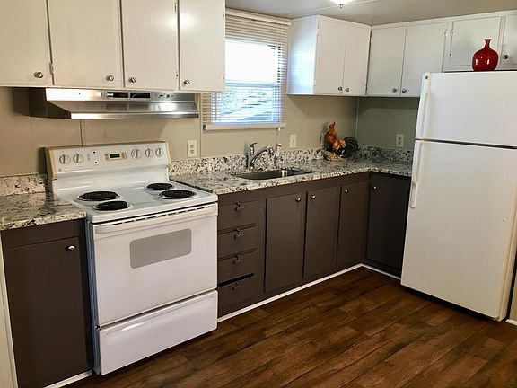 Efficient kitchen with new granite counter tops.