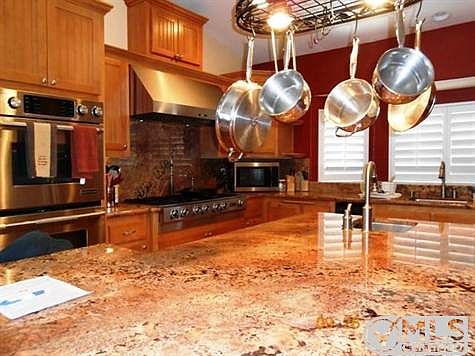 Large kitchen with Jennair commercial grade stove, 6 burner,