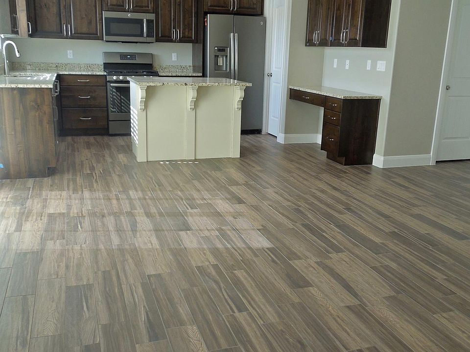 Open Floor Plan connecting entry foyer, living-dining area, and well-appointed kitchen.