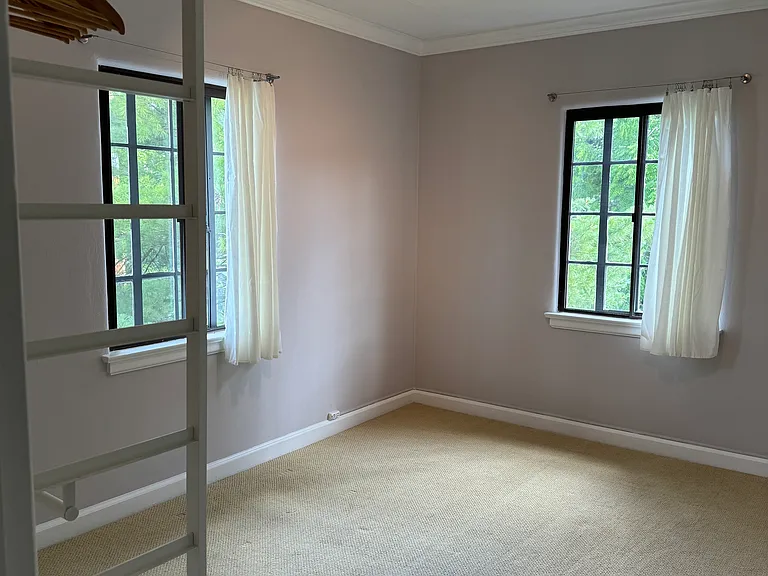 Bdrm. #2 with exterior clothing organizer.