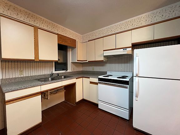 Open concept kitchen - includes (new) electric stove and fridge.