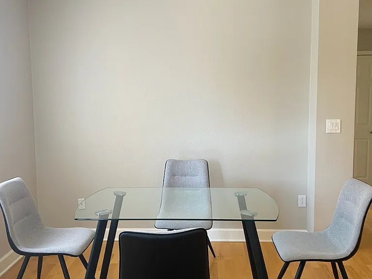 View of dining area from the living room. Down the hallway from the dining area is the laundry area. Washer and dryer included.