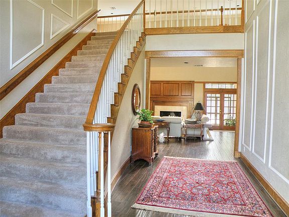 Beautiful two story entry and den with extra wide staircase