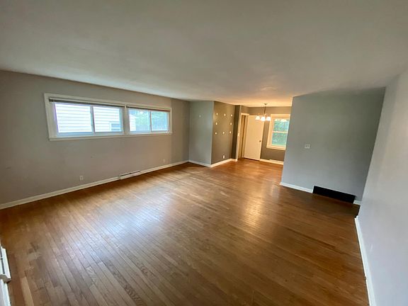 Living room blends to the dining area adjacent to the kitchen.