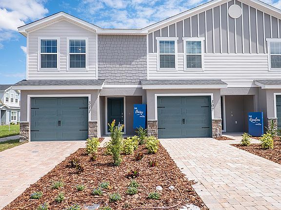 The Azalea offers 1,730 sq ft of living space with a 1-car garage and paver driveway.