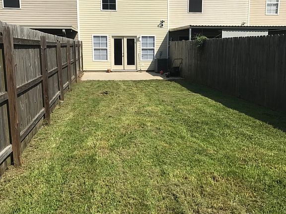 Large back yard with privacy fence.