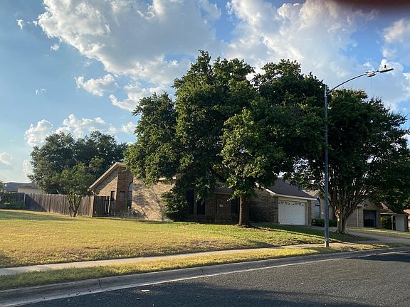 Look at these massive oak trees that shade this lovely home. Vacant lot next door owned by same owner