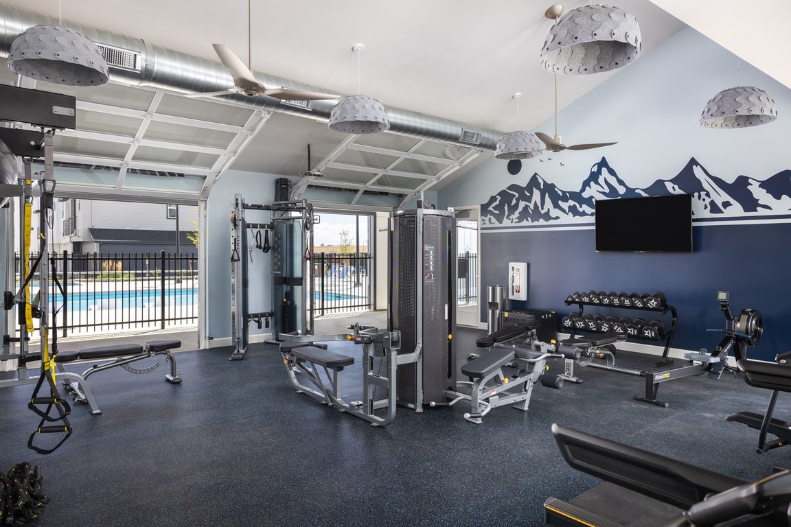 24 Hour Fitness Center with Garage Doors for Fresh Air