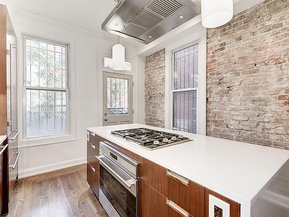 Chef's kitchen with Wolf gas cooktop, Subzero fridge, Miele dishwasher, and Wolf oven