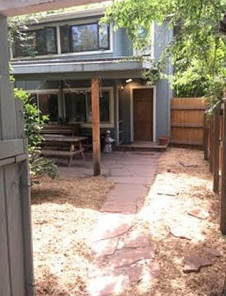 Walkway to front door, after entering through the front gate. Also, a view of the covered porch.