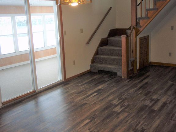 New laminate flooring in dining - slider to screen porch